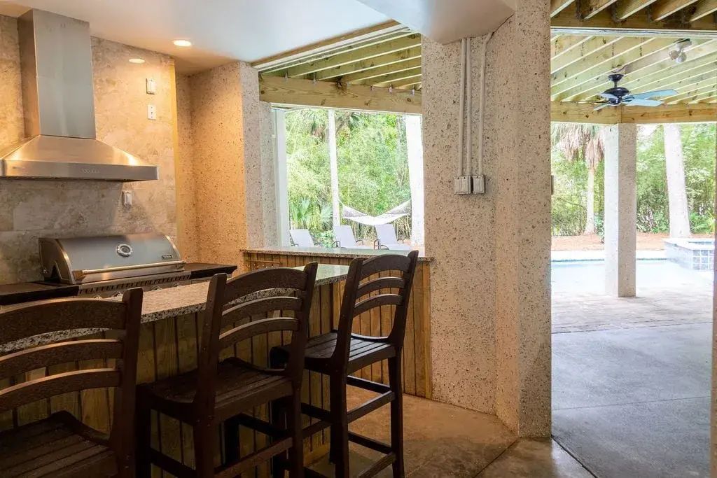 Outside, under house, bar and cooking area
